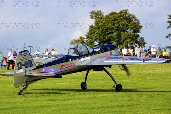 A Jakovlev Jak-55 with the registration LY-AGL during a flight demonstration as part of an air show