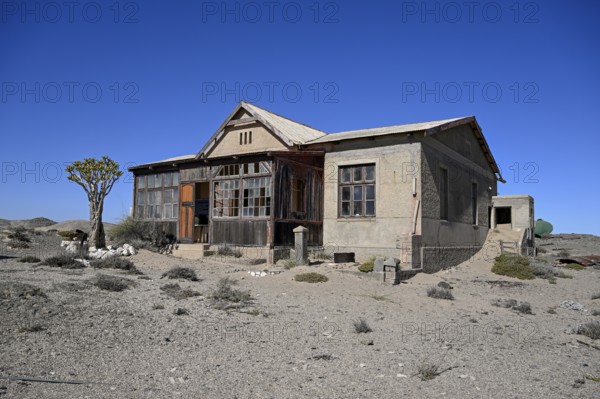 Dilapidated building in the desert sand, Pomona, restricted diamond area, near Lüderitz, Karas