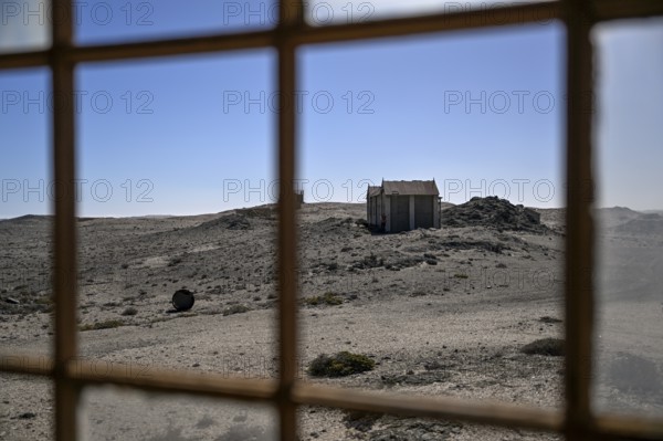 View from a dilapidated building into the desert, Pomona, restricted diamond area, near Lüderitz,