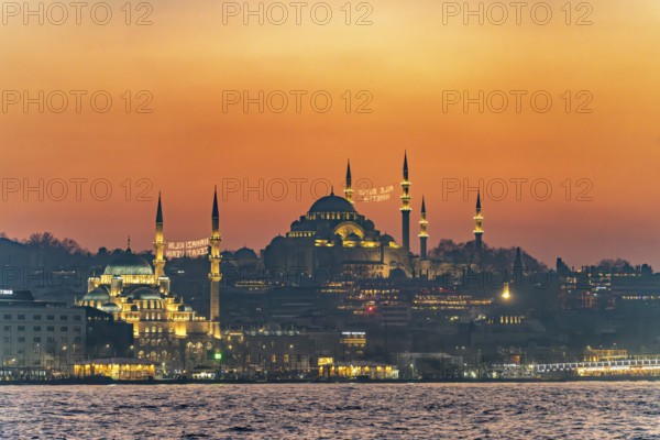 The New Mosque Yeni Cami and the Süleymaniye Mosque at dusk, Eminönü, Istanbul, Turkey