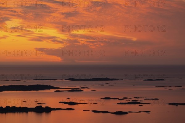 Offshore islands and skerries, sea, dramatically illuminated clouds, sunset, Otroya or Otrøya