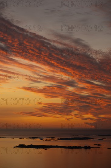 Offshore islands and skerries, sea, dramatically illuminated clouds, sunset, Otroya or Otrøya