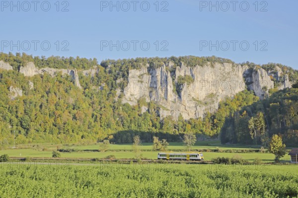 Railway line with train and view of rock formations, landscape, rock formations, rock cliffs,