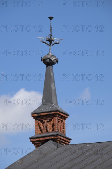 Gable with weather vane and ornamental iron elements, former paper factory and mill for the