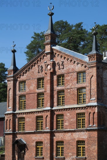 Brick façade with inscription 1893, former paper factory and mill for the production of groundwood