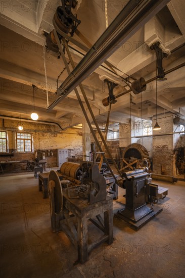 Factory hall with historical machines for the production of cardboard and paper, former paper