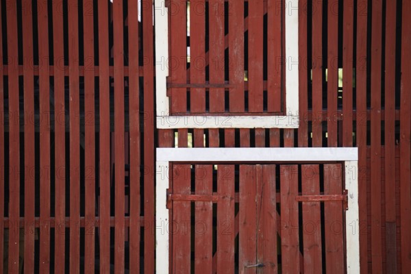 Falun red painted wooden slats of a barn, former paper factory and mill for the production of