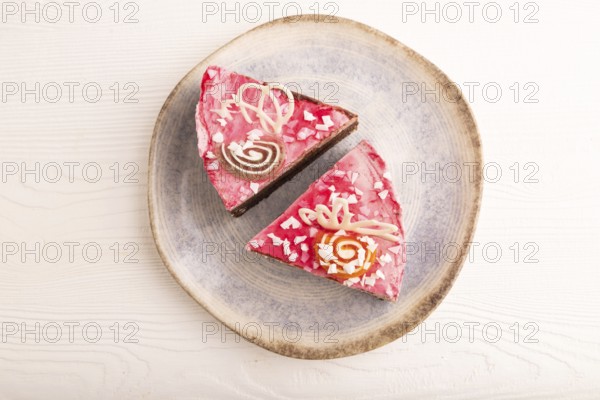 Chocolate cake on white wooden background, top view, flat lay, close up