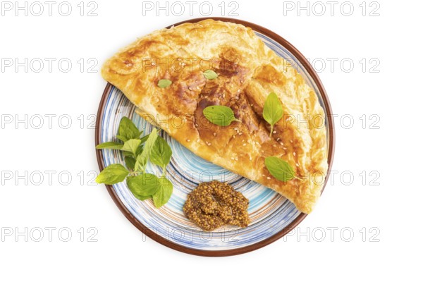 Fried homemade Khachapuri cake with cheese and meat, fried in pan. Traditional Georgian cuisine