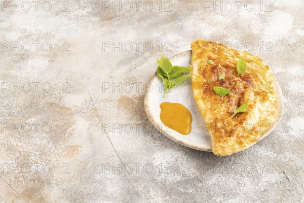Fried homemade Khachapuri cake with cheese and meat, fried in pan. Traditional Georgian cuisine on