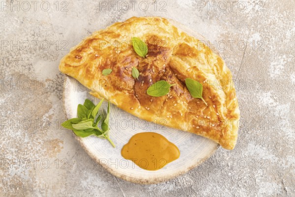 Fried homemade Khachapuri cake with cheese and meat, fried in pan. Traditional Georgian cuisine on
