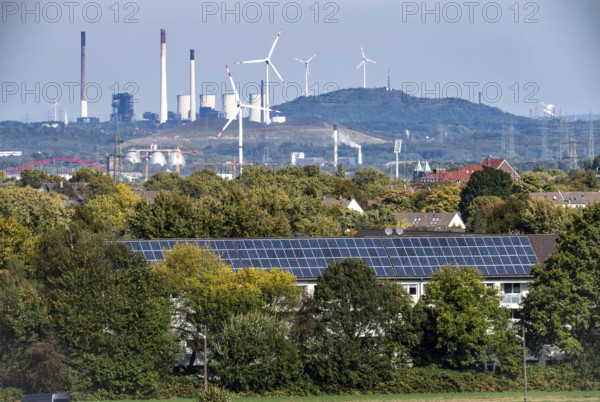 View over the western Ruhr area, from Essen-Haarzopf, housing estate with large photovoltaic