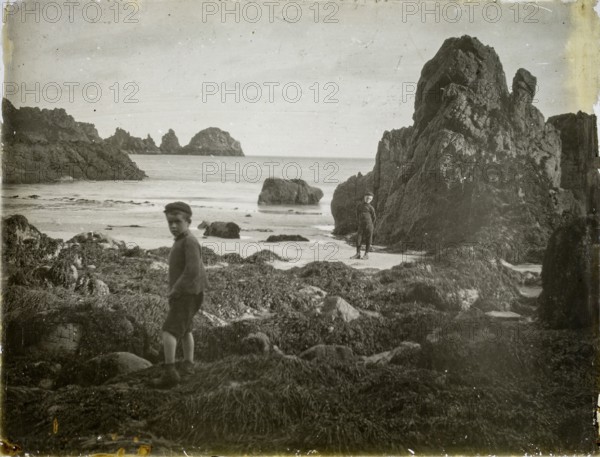 Magic lantern slide two boys playing on rocky beach circa 1900, Moulin Huet Bay, Guernsey, Channel