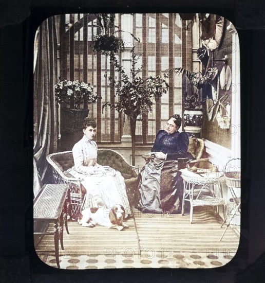A colourised magic lantern slide of Queen Mary, when Princess May of Teck, with her mother, the