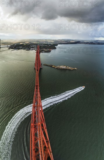Horizontal panorama of Rain clouds over Forth Bridge from a drone, Queensferry Crossing, Forth