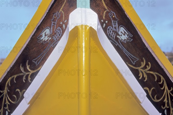 Part of bow of fishing boat with typical colourful painting for Maltese fishing boats, Valletta,