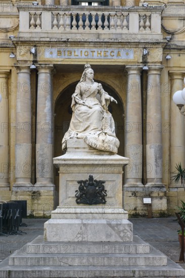 Marble statue of Queen Victoria of Great Britain in front of entrance to National Library of Malta