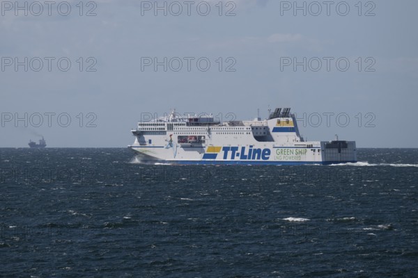 LNG-powered TT-Line ferry travelling across a gently moving blue sea, near Warnemünde, Rostock,