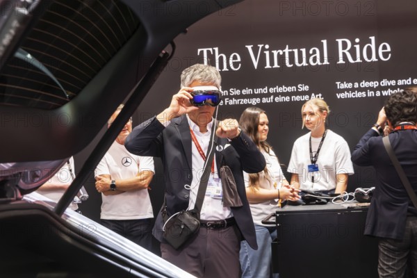 Mercedes trade fair stand with virtual presentation. Trade fair visitors with 3D glasses. The