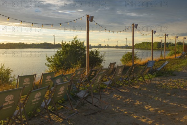 View from the outdoor area of a restaurant at Lankenauer Höft over deckchairs through a string of