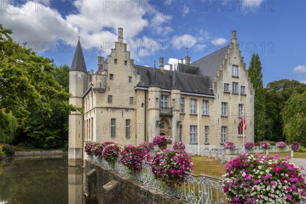 Kasteel Cortewalle, 15th century moated castle in Flemish Renaissance style at Beveren in summer,