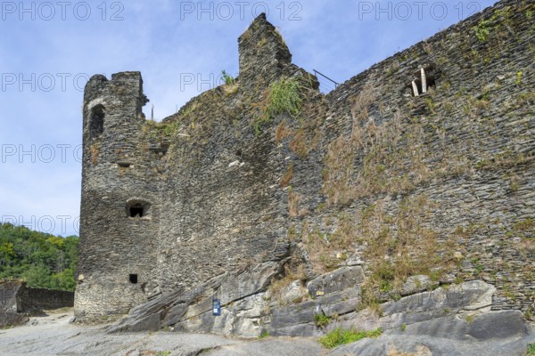 9th century medieval ruined hill castle overlooking the city La Roche-en-Ardenne in summer,