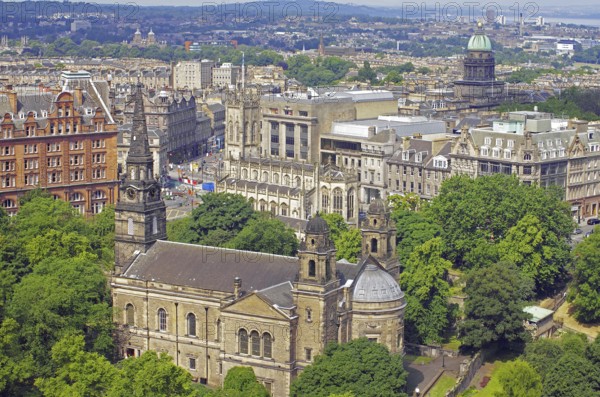 View of a cityscape with impressive architecture and lots of greenery, view from Edinburgh Castle,