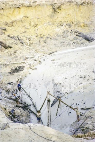 Open Cast gravel-pumping tin mine Malaya, Malaysia, south east Asia 1964 - high pressure water