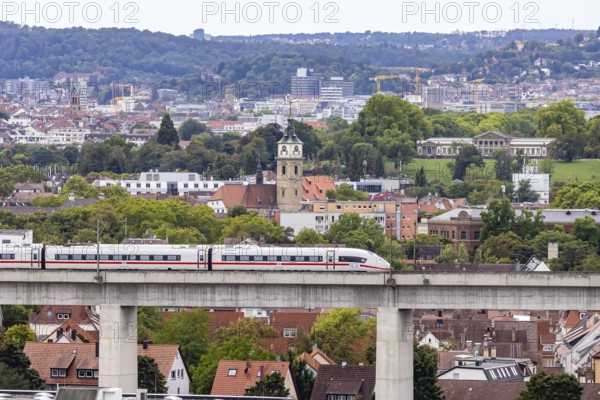 Deutsche Bahn AG ICE train travelling on the Schusterbahn, Münster viaduct with city view of Bad