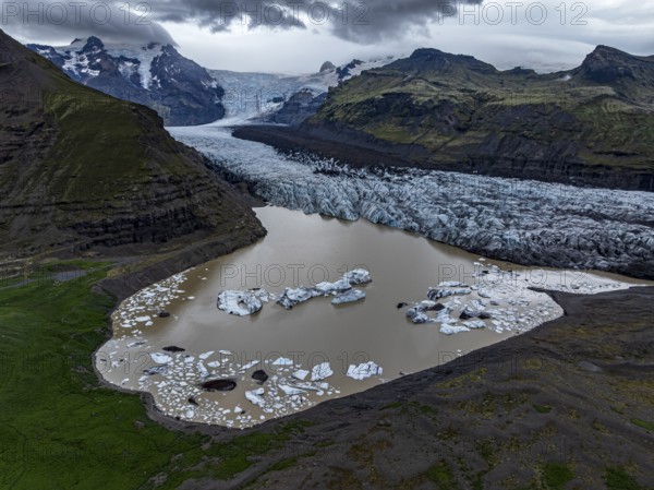 Glacier, glacier tongue, glacier lake, mountains, cloudy, aerial view, summer, Svinafellsjökull,