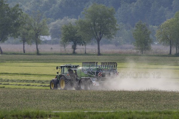Tractor driving with slurry tanker, meadow, dust, drought, summer, Alpine foothills, Bad-Tölz
