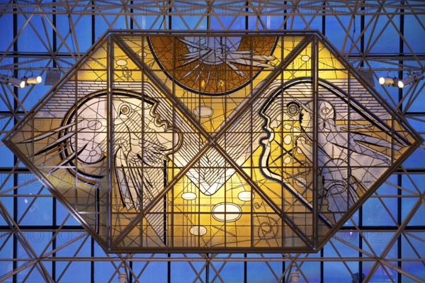 Stained glass artwork entitled Icarus, one of two glass artworks by Leifur Breidfjörd at Keflavik