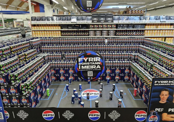 Football stadium built from beverage cans for the European Women's Championship in the supermarket,