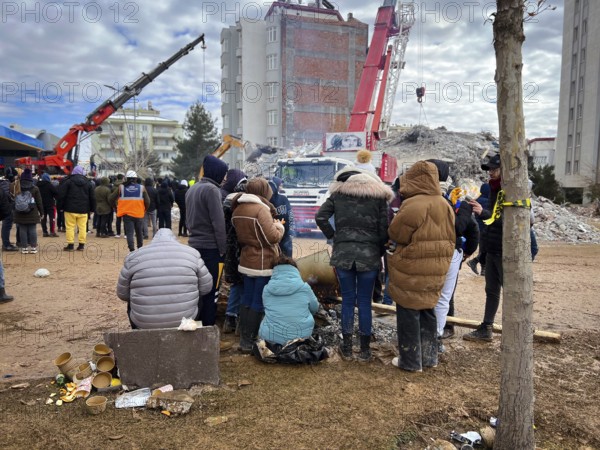 Turkish civil defense teams (AFAD) search for survivors under the rubble after a powerful 7