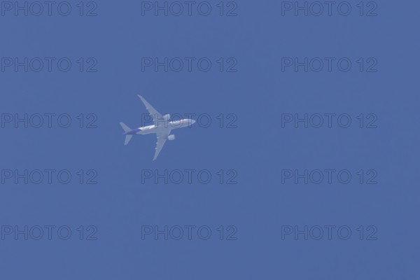 Airbus A300-600RF jet aircraft of FedEx Express airlines in flight in a blue sky, England, United