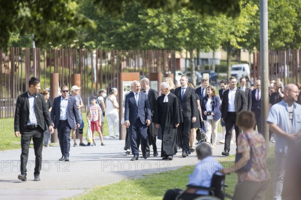 Kai Wegner (Governing Mayor of Berlin) walks to a wreath-laying ceremony to commemorate the