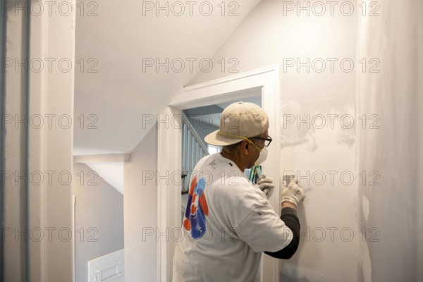 Detroit, Michigan - Workers remodel a house in the Morningside neighborhood that had been vacant