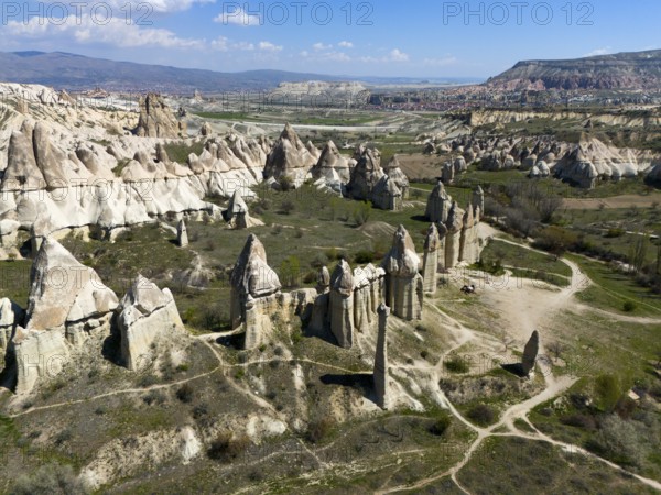 Wide rocky backdrop with outstanding geological formations in Cappadocia, aerial view, Love Valley,