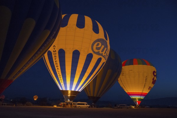 Hot air balloons at night with colourful lighting, creating a fascinating and atmospheric ambience,