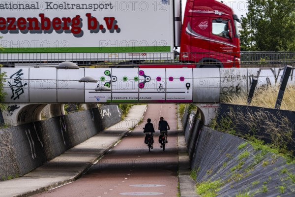 Rijnwaalpad long-distance cycle path, near the village of Elst, subway of the A15 motorway, wide