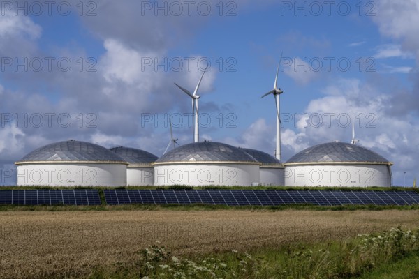 Wind turbines of a wind farm near Eemshaven, VOPAK tank farm, solar plant, Netherlands
