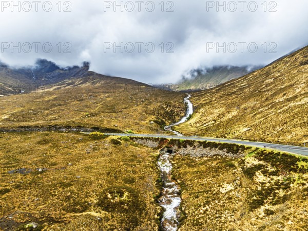 Eas a' Bhradain Waterfall from drone, Red Cuillin mountains, Loch Ainort, Isle of Skye, Scotland,