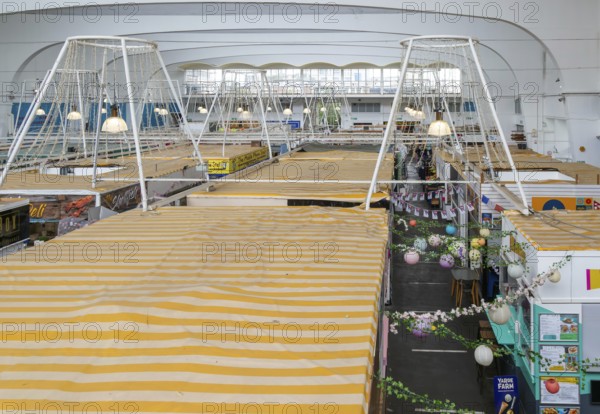 Raised view over roofs of market stalls in Market Building or Pannier Market, city of Plymouth,
