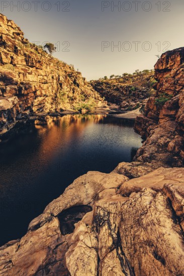 Bell Gorge waterfall, a body of water in north-west Australia in the Kimberley. Sunrise in the
