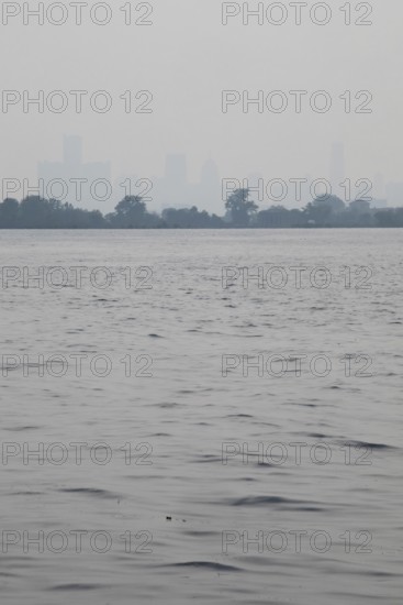 Detroit, Michigan USA - 4 August 2025 - Smoke from Canadian wildfires nearly erases the downtown