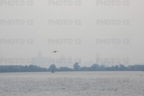 Detroit, Michigan USA - 4 August 2025 - Smoke from Canadian wildfires nearly erases the downtown