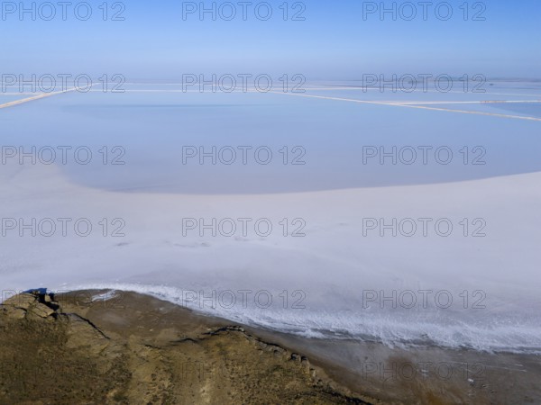 A tranquil salt landscape under a clear sky, minimalist and expansive, aerial view, salt lake, Tuz