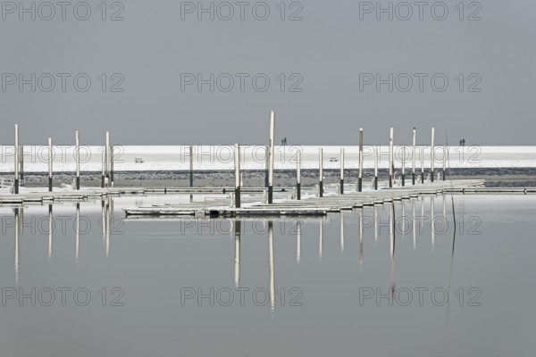 Winter day, onset of winter, snow on the jetties in the marina, North Sea, Norddeich, Lower Saxony,