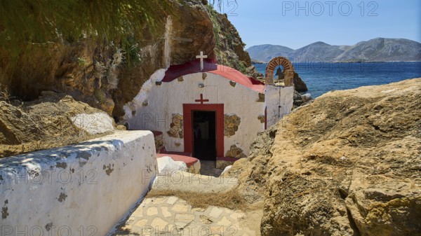Legend, Crab, Mussel fisherman, Beautiful chapel on the rocky Mediterranean coast in sunny weather,