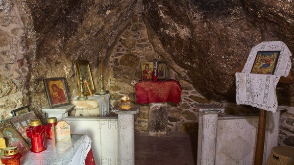 Legend, Crab, Mussel fisherman, Small chapel interior with candles and religious icons on a stone